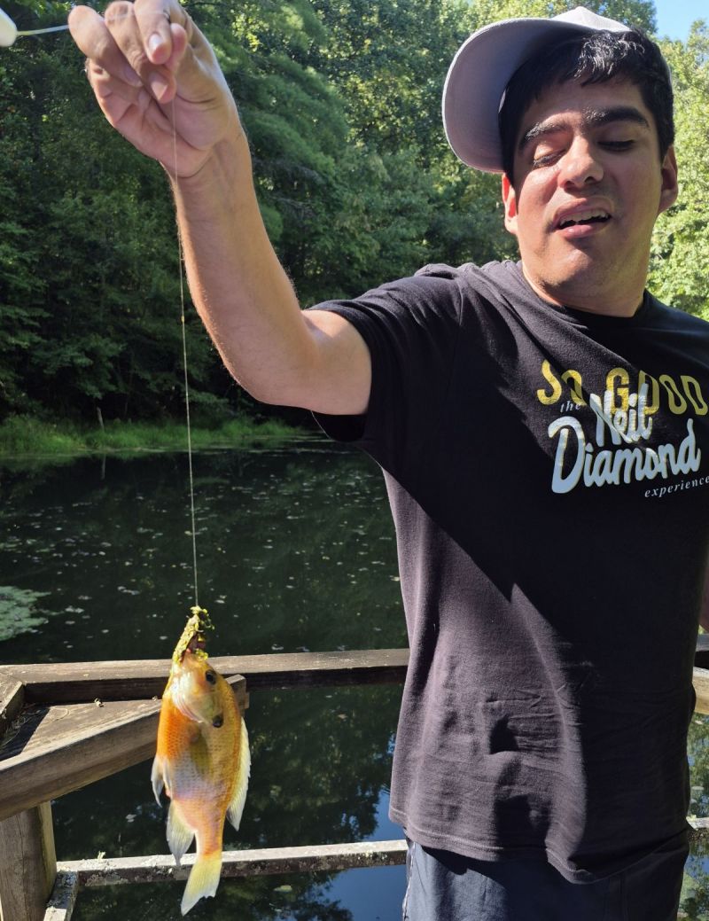 Austin catching fish in Crawford pond