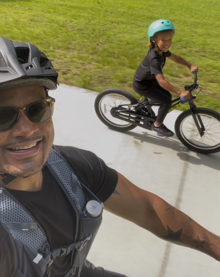 Dad and Evan riding bikes