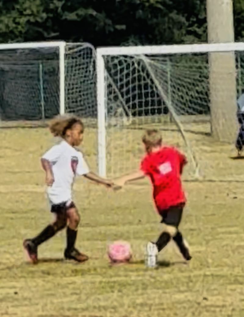 Evan playing soccer