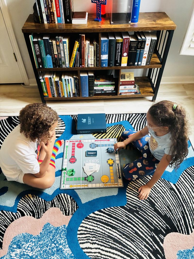 Evan and Sophia playing the family’s favorite board game Sorry