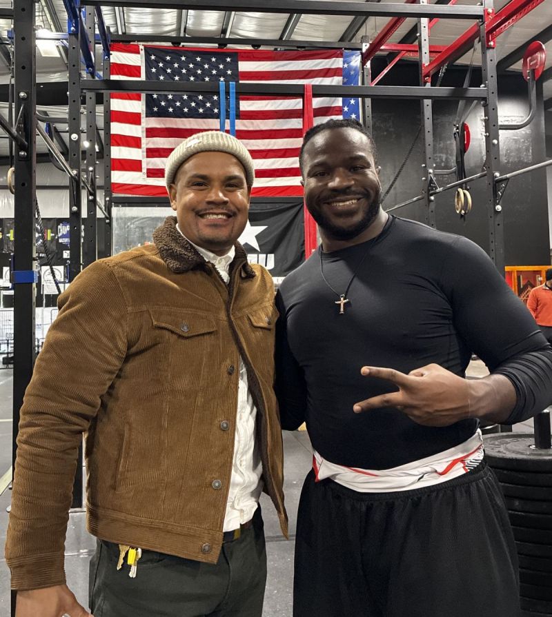 Samad supporting his Brother John B. at his powerlifting competition. 