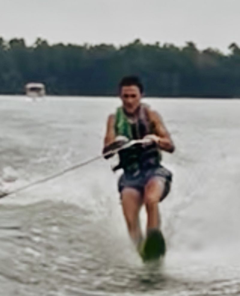 Kyler learning to slalom ski with Captain Keith Sims 
