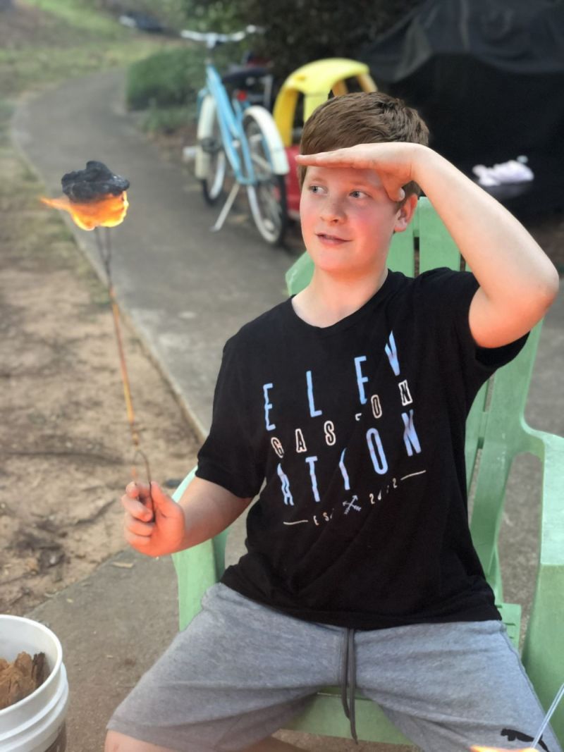 Anthony torching his marshmallow.