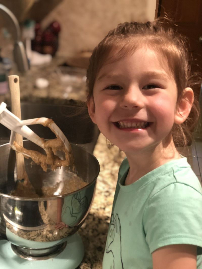 Charlotte helping in the kitchen.