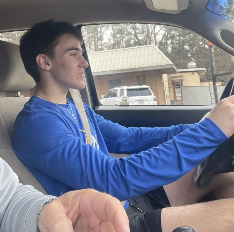 Jason teaching Kyler professional driving techniques.  